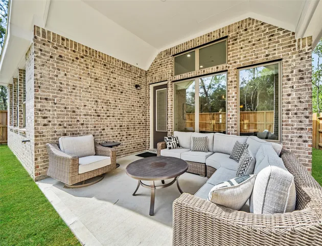 a outdoor living space with patio furniture and a couch