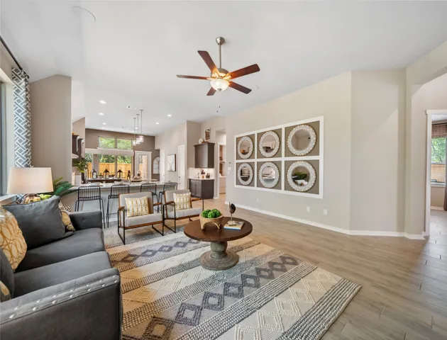 a living room with furniture and a rug