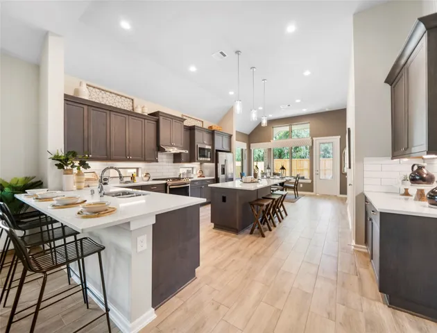 a kitchen with a sink a counter top space and appliances