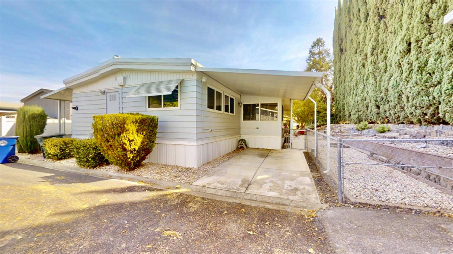 Parking in front side of unit with a wheelchair lift on left front covered porch. Additional parking behind unit.