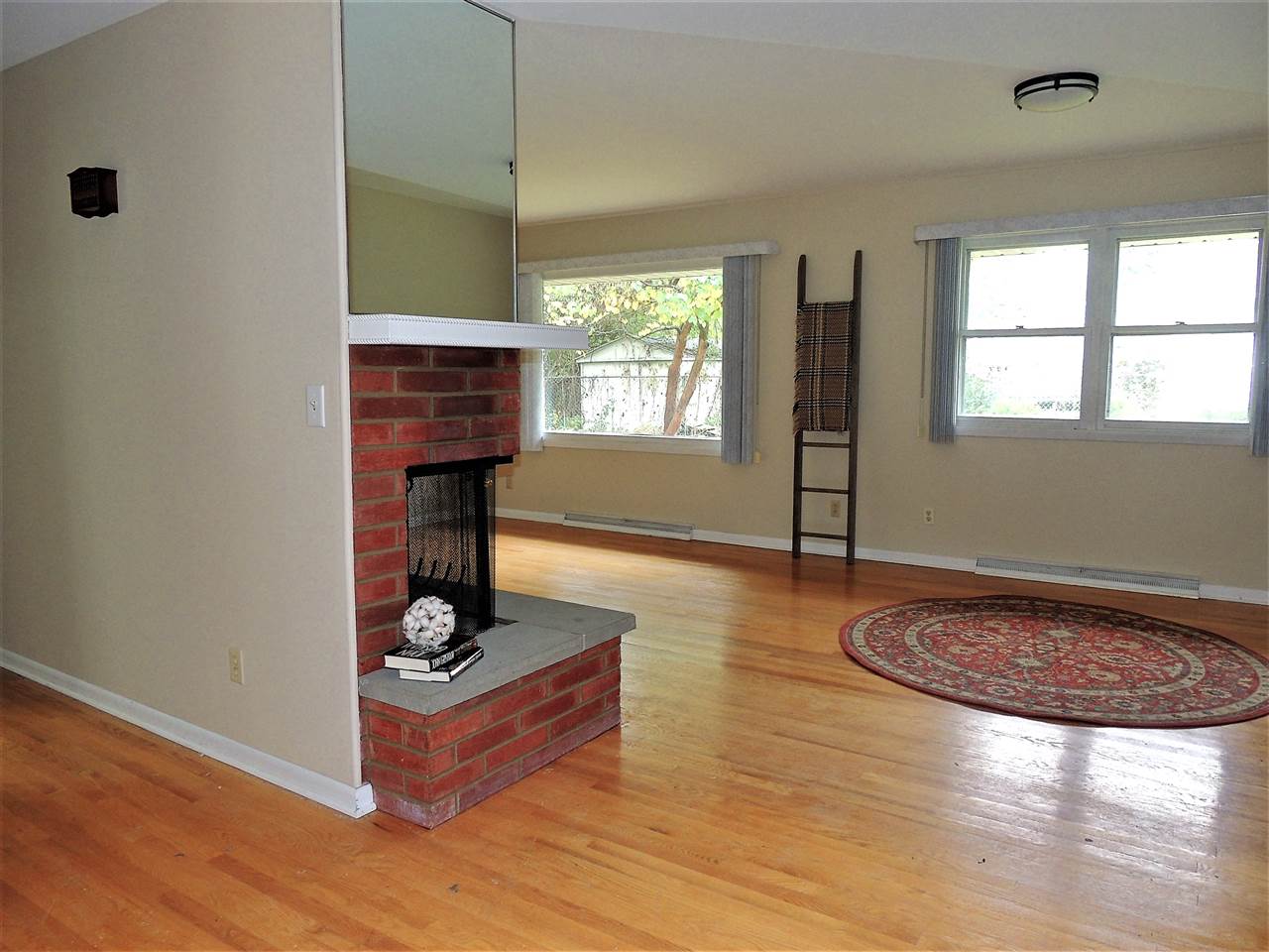 6233 Park Ridge Road Loves Park, IL 61111 - Photo 4 of 20 a living room with furniture and a fireplace