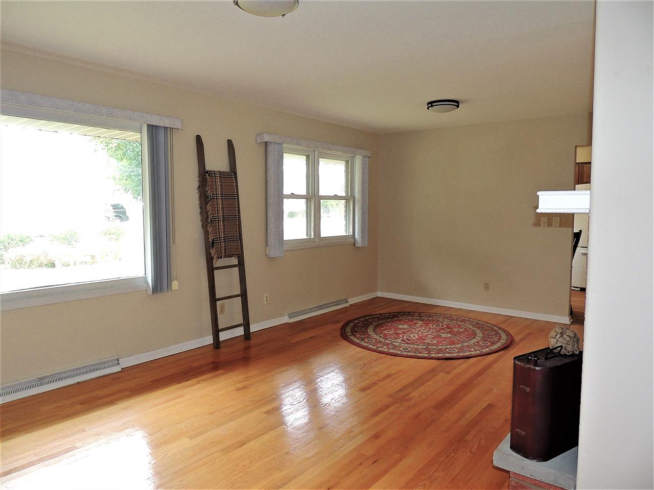 6233 Park Ridge Road Loves Park, IL 61111 - Photo 6 of 20 a view of a room with window wooden floor and front door