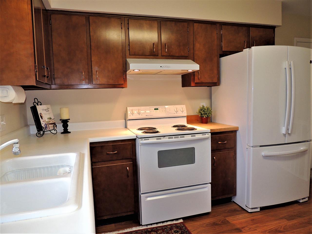 6233 Park Ridge Road Loves Park, IL 61111 - Photo 9 of 20 a kitchen with a refrigerator sink and cabinets