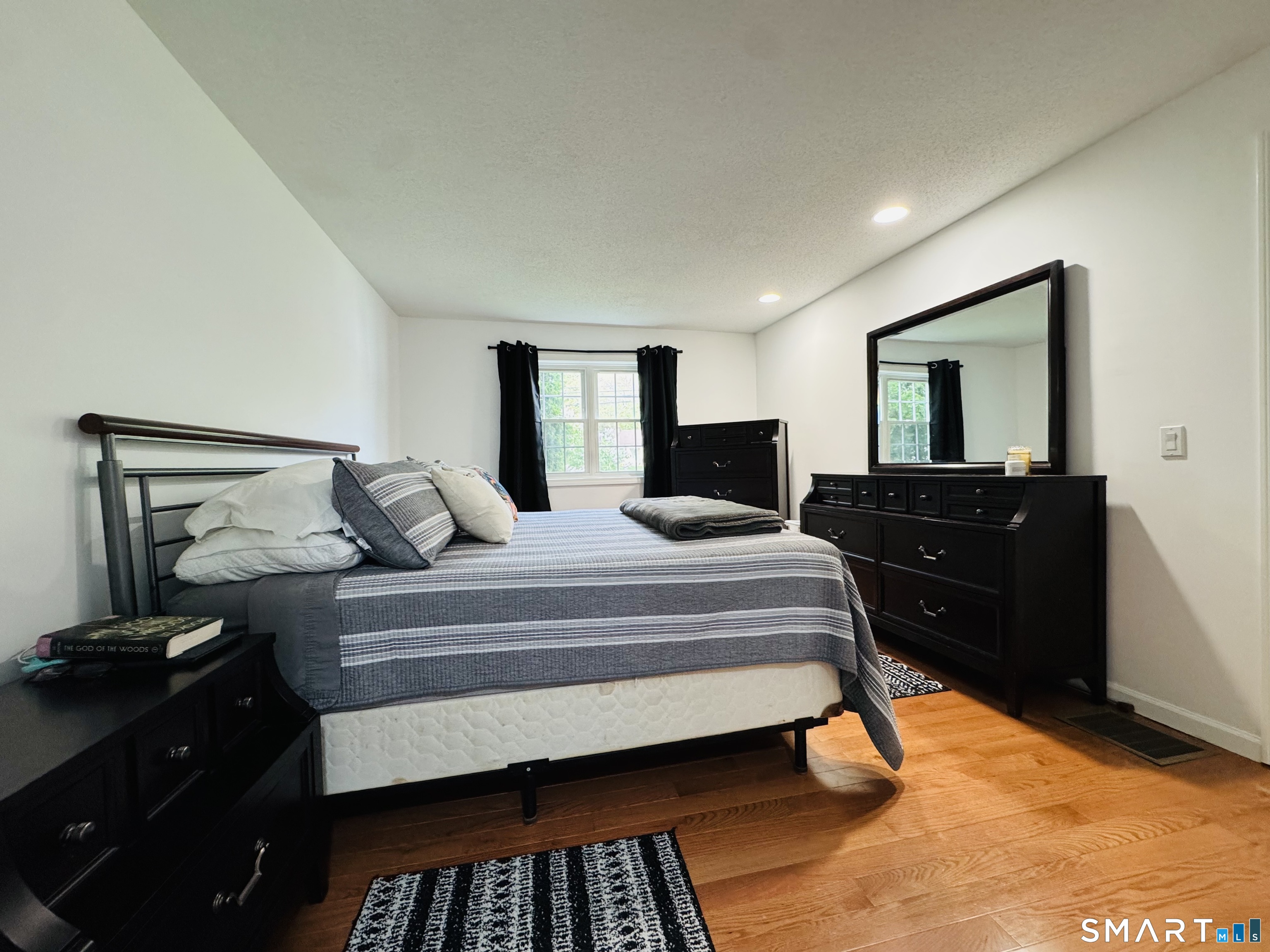 1514 Woodtick Road Wolcott, CT 06716 - Photo 8 of 23 a bedroom with a bed and window