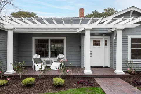 a front view of a house with garden