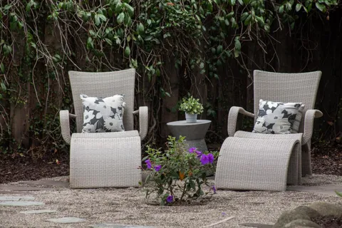 a wooden bench sitting in middle of a yard
