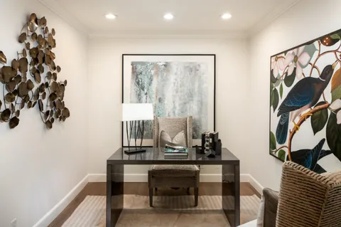 a view of a workspace with furniture