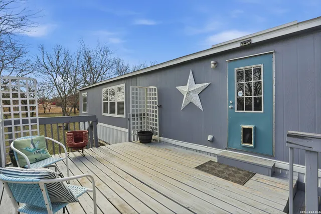 a balcony with table and chairs