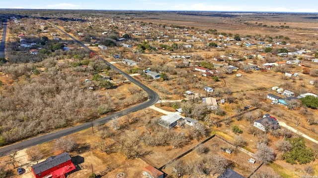 a view of a chairs and table in the balcony