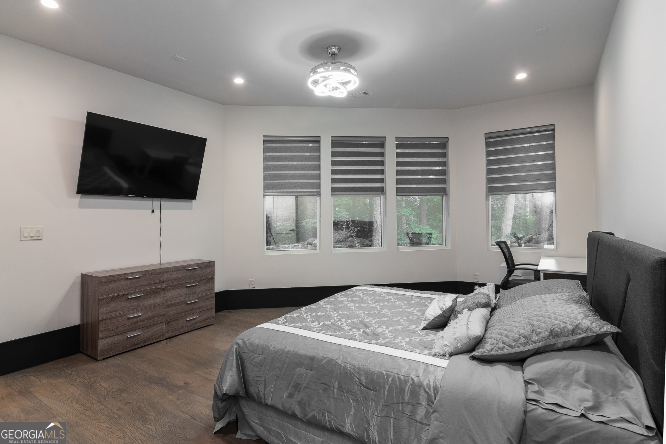 2401 Greenglade Road Northeast Atlanta, GA 30345 - Photo 26 of 42 a bedroom with a bed and a flat screen tv