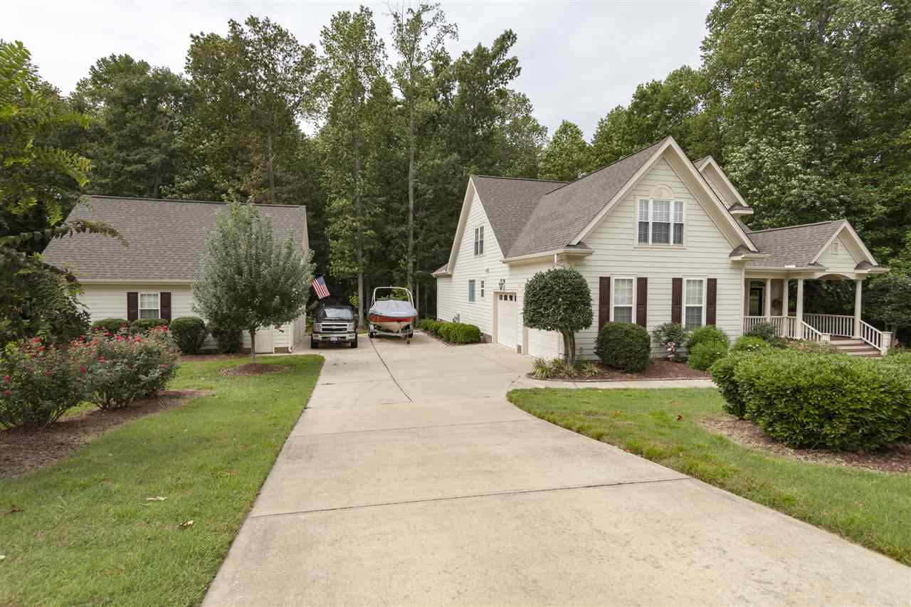 Oversized attached and detached garages with ample parking and parking pad for a boat or additional vehicles. Garage built-ins do not convey. Exterior Front