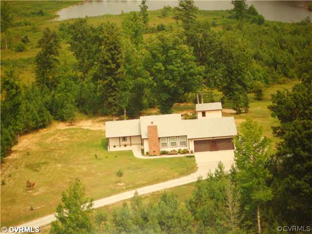 a view of a yard with an outdoor seating