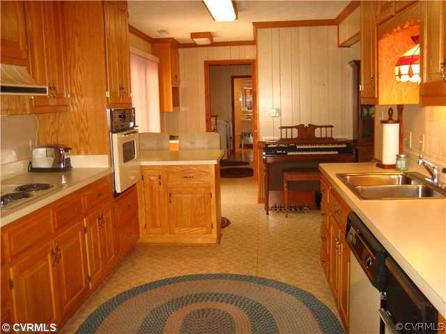 2347 Danieltown Road Goochland, VA 23063 - Photo 6 of 12 a large kitchen with stainless steel appliances granite countertop a sink and a refrigerator