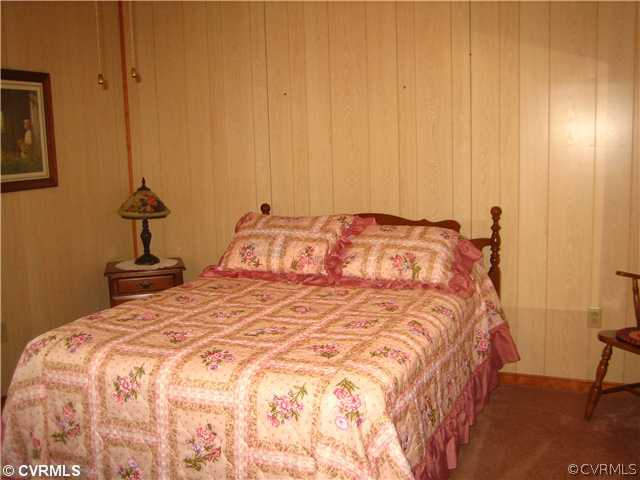 2347 Danieltown Road Goochland, VA 23063 - Photo 8 of 12 a bedroom with a bed and a table