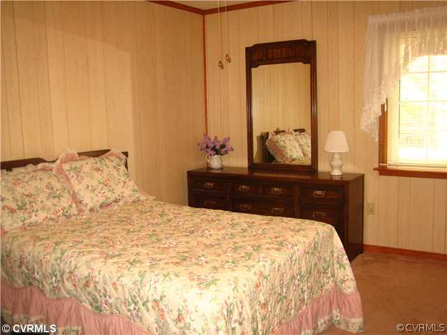 2347 Danieltown Road Goochland, VA 23063 - Photo 9 of 12 a large bedroom with a bed and large windows