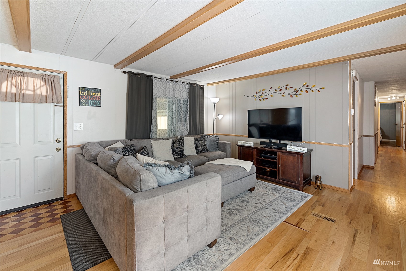 7311 Chambers Creek Road West, Unit 20 University Place, WA 98467 - Photo 15 of 23 a living room with furniture and a flat screen tv