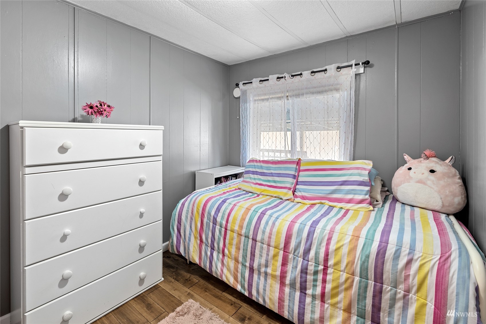 7311 Chambers Creek Road West, Unit 20 University Place, WA 98467 - Photo 20 of 23 a bedroom with a bed and window