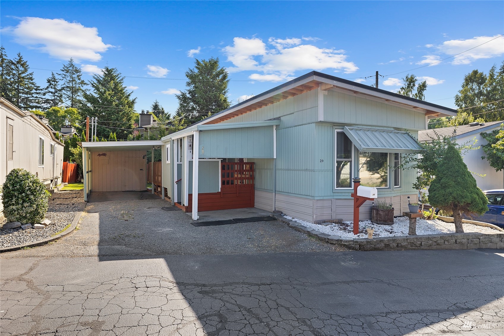 7311 Chambers Creek Road West, Unit 20 University Place, WA 98467 - Photo 2 of 23 a view of a house with backyard and trees