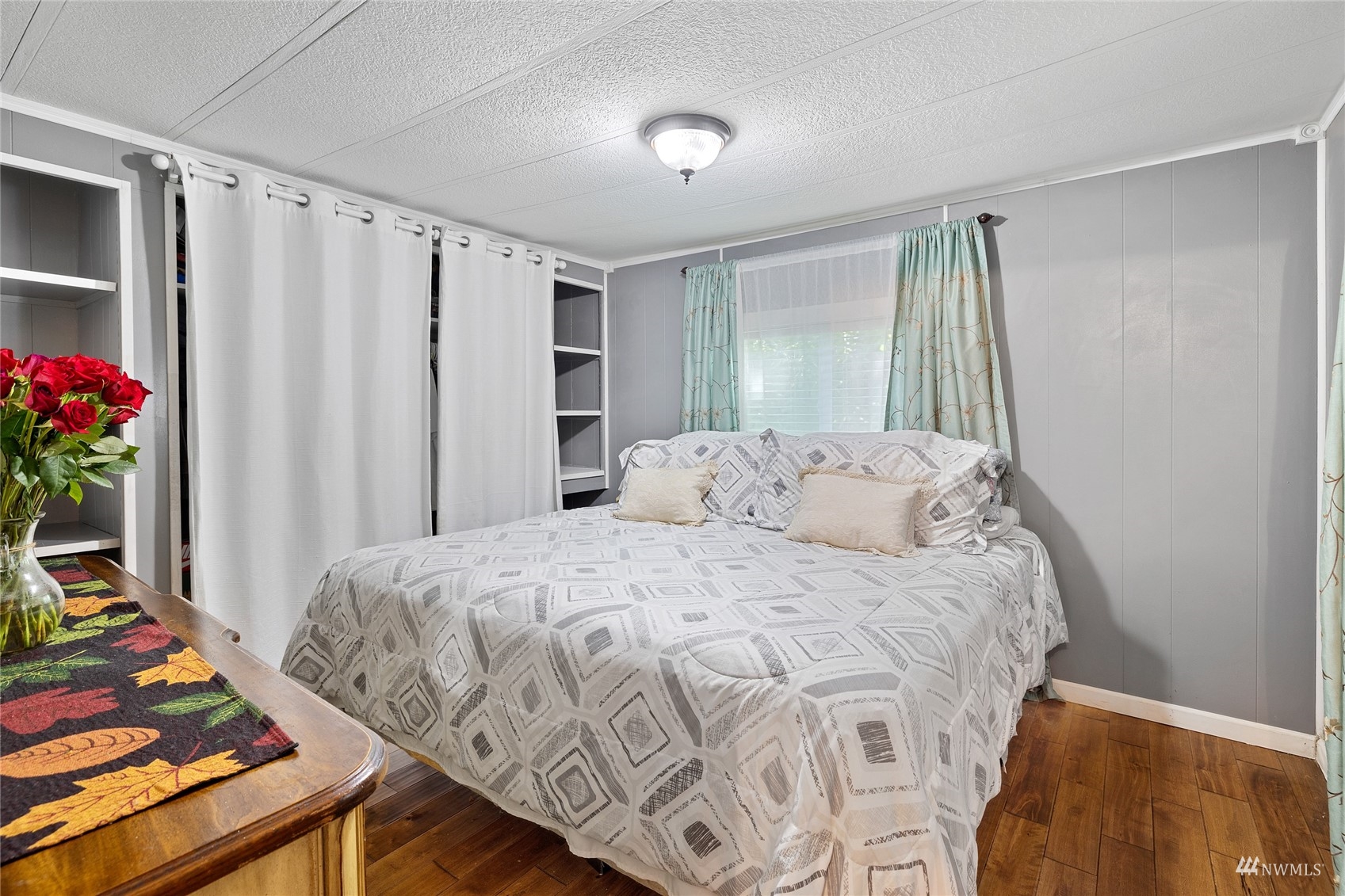 7311 Chambers Creek Road West, Unit 20 University Place, WA 98467 - Photo 23 of 23 a bedroom with a bed and a dresser