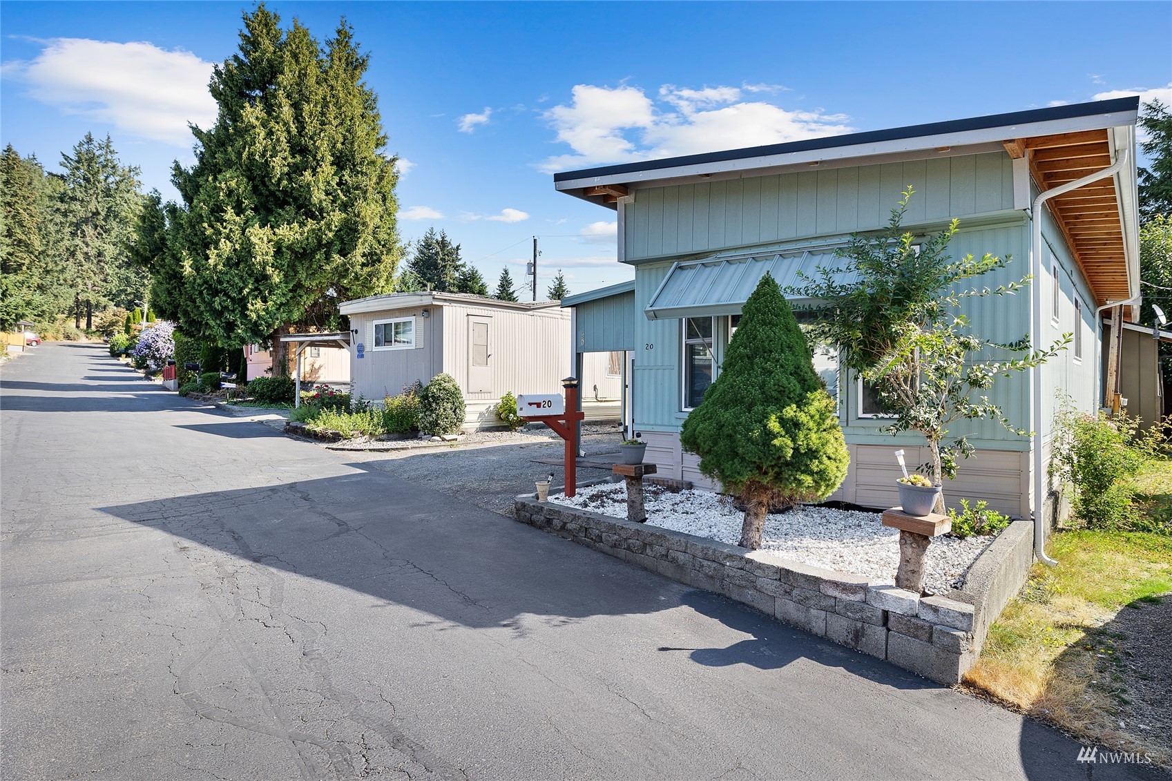 7311 Chambers Creek Road West, Unit 20 University Place, WA 98467 - Photo 3 of 23 a front view of a house with garden