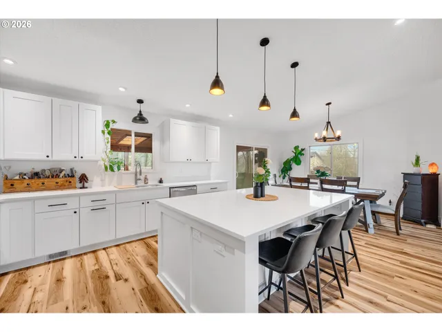 a kitchen with a table and chairs in it