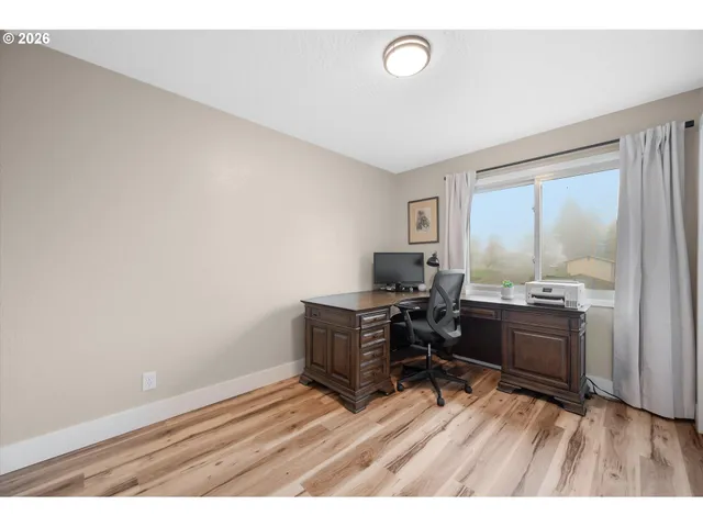 a room with a wooden floor and furniture