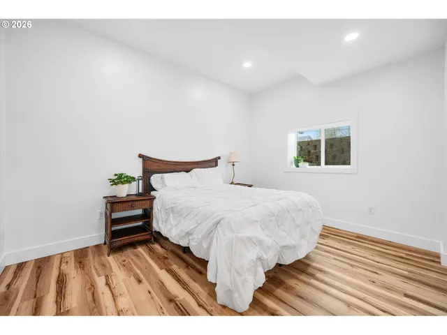 a bedroom with a bed and a table