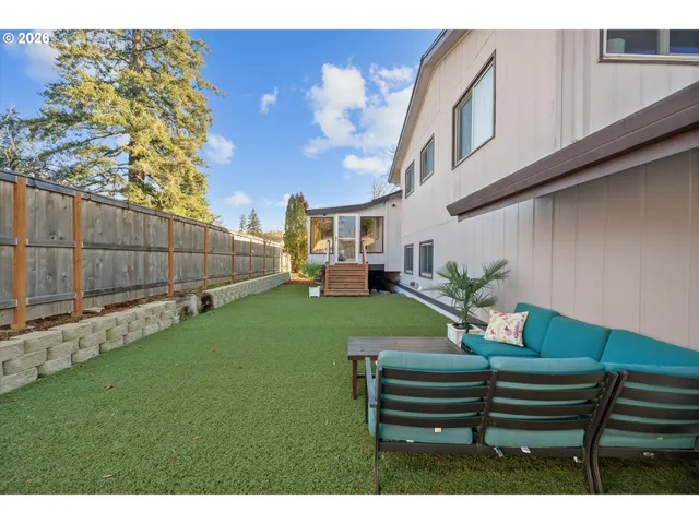 a view of a bench in a backyard