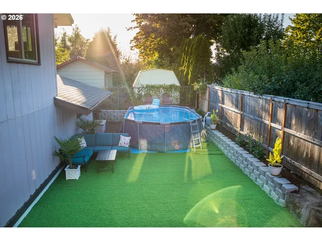 an aerial view of a house with a swimming pool