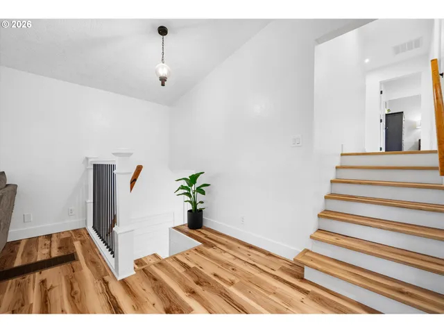 a view of entryway with wooden floor