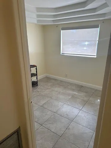 a view of a room that has a window in it