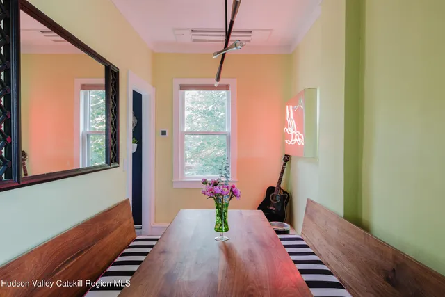 a table with wine bottles and glasses on it