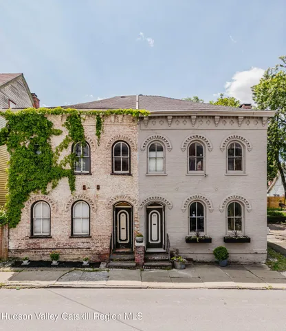 a black and white photo of a bench