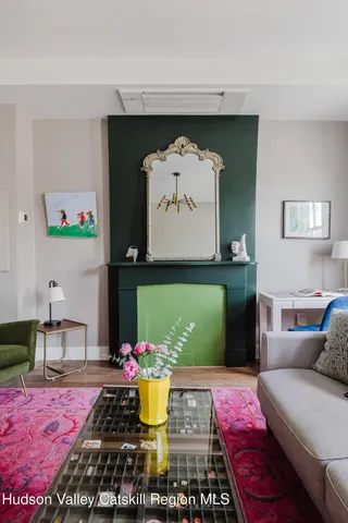 a living room with furniture and a rug