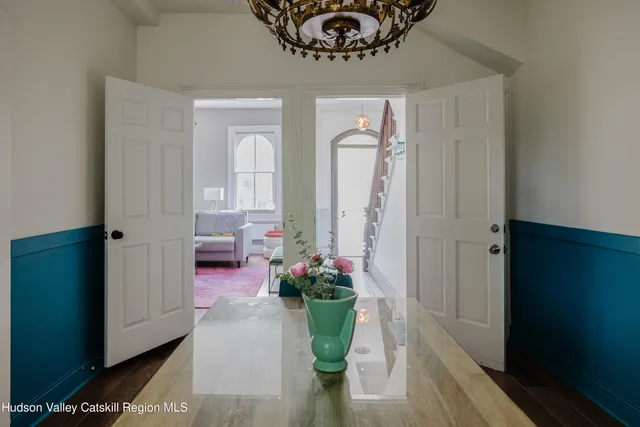 a dining room with furniture and window