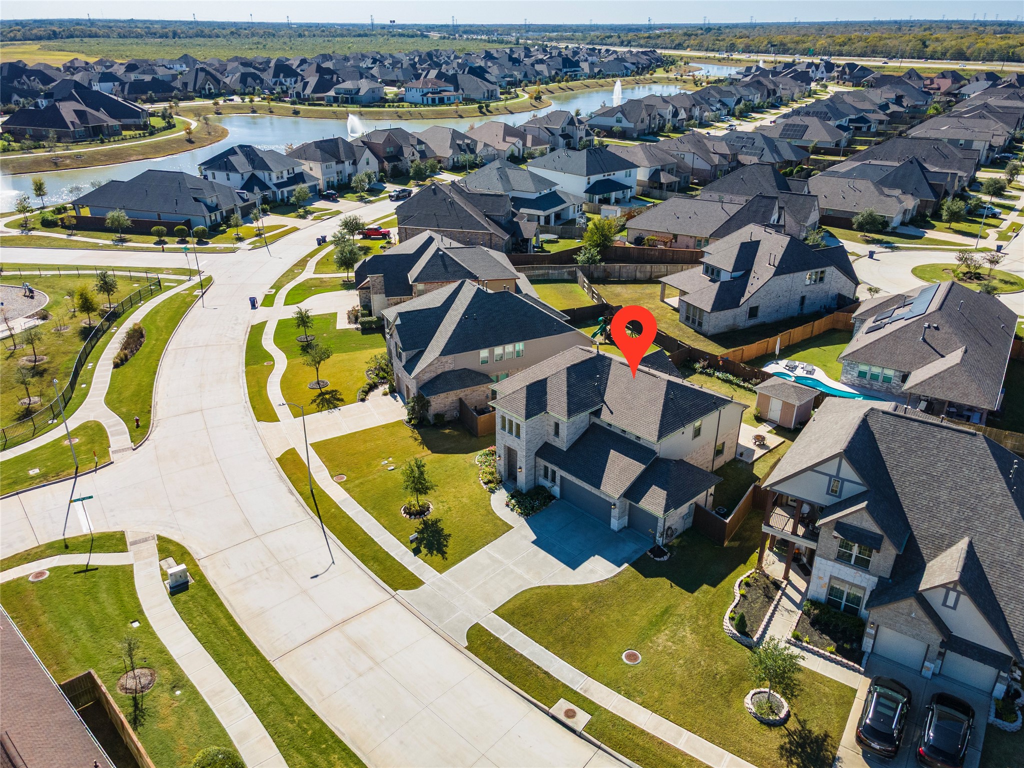 6034 Lake Bridge Lane Manvel, TX 77578 - Photo 33 of 33 an aerial view of a swimming pool yard and mountain view in back