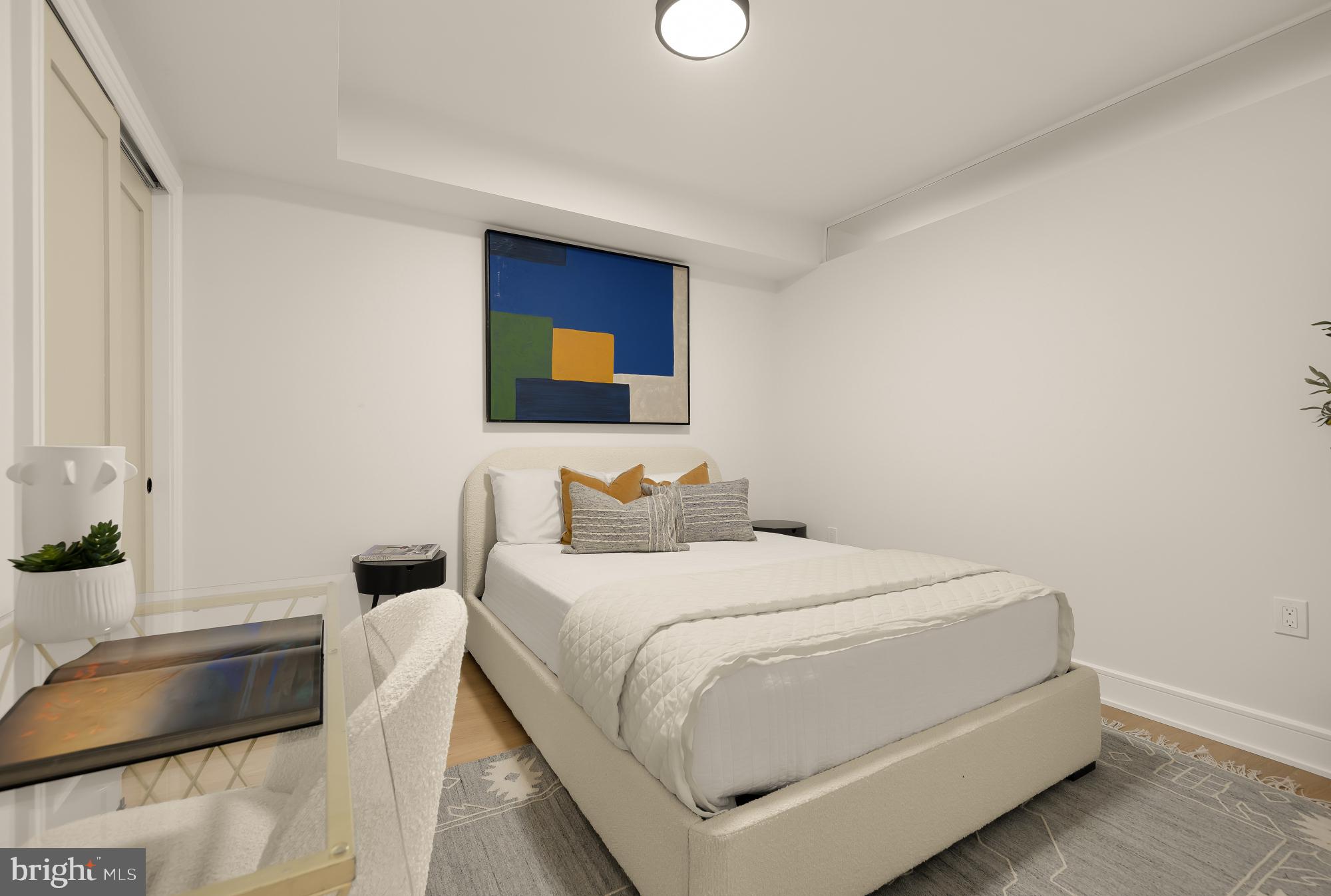 1463 Harvard Street Northwest, Unit 2 Washington, DC 20009 - Photo 13 of 25 a bedroom with a bed and a couch