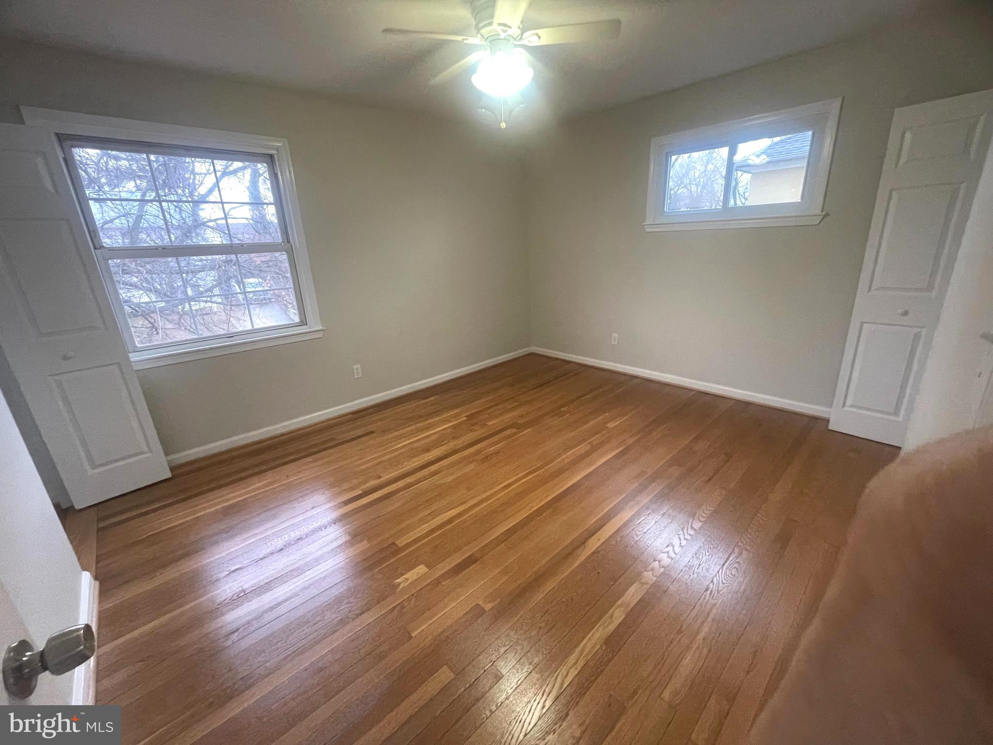12120 Centerhill Street Silver Spring, MD 20902 - Photo 23 of 31 Owner's bedroom: hardwood floors, 2 large windows.
