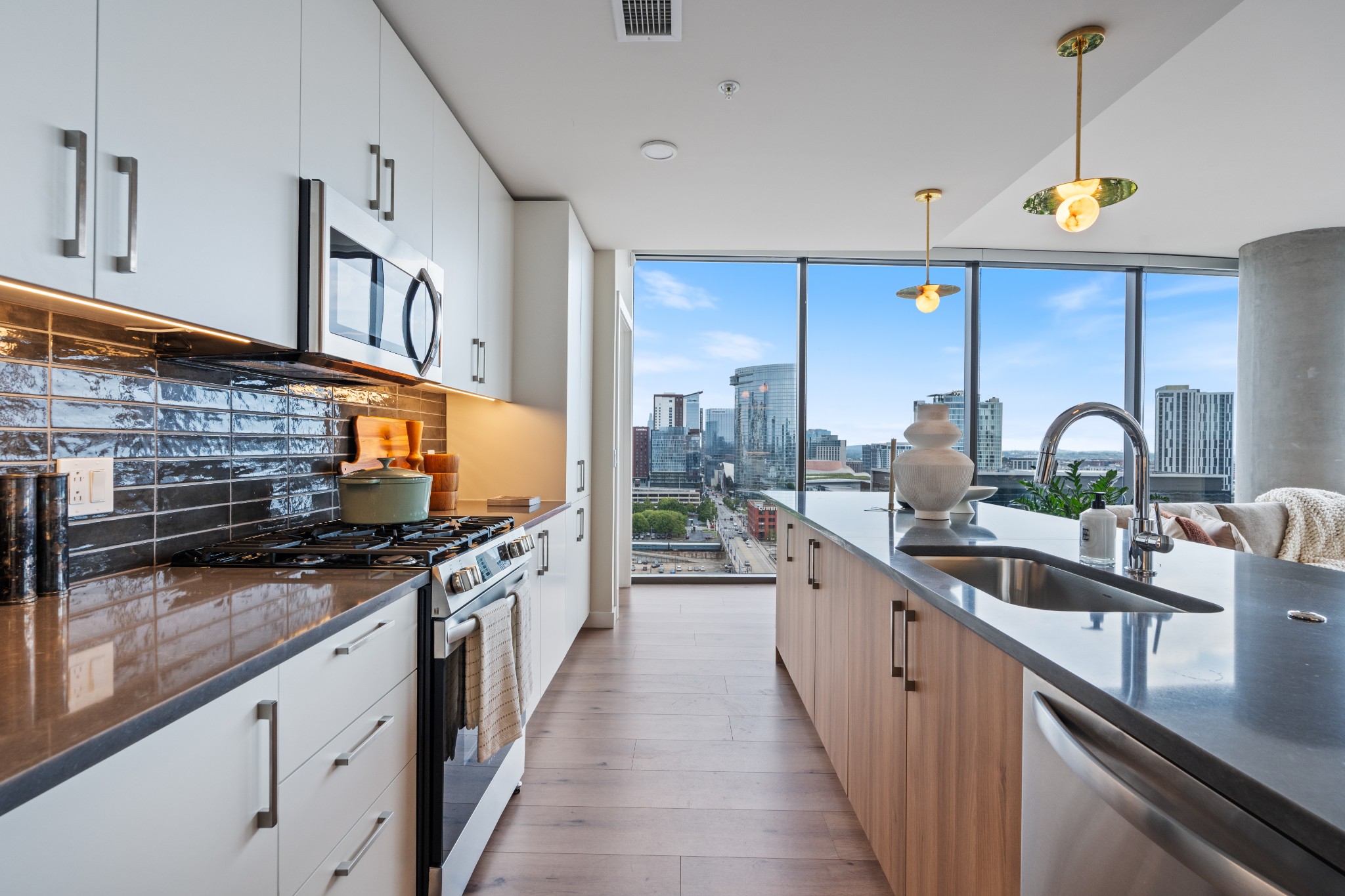 1212 Demonbreun Street, Unit B3 (Y) Nashville, TN 37203 - Photo 5 of 34 a kitchen with stainless steel appliances a sink a stove and a wooden floors