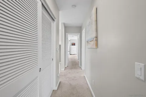 a bathroom with a granite countertop sink a mirror and a shower