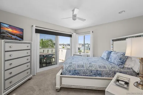 a balcony with table and chairs