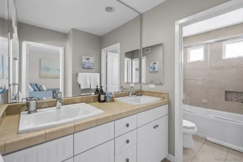 an aerial view of a house with a mountain