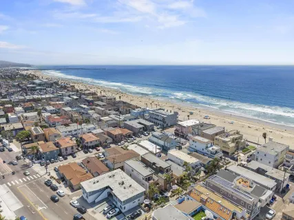 a balcony with table and chairs