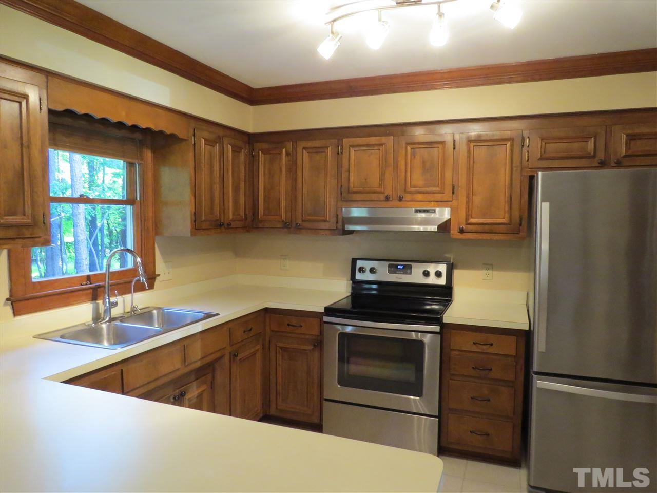 905 Skinners Ridge Road Raleigh, NC 27614 - Photo 3 of 21 a kitchen with a refrigerator stove and sink