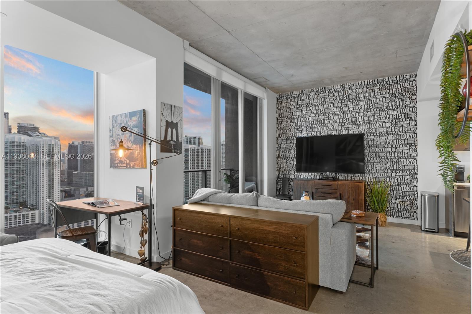 151 Southeast 1st Street, Unit 3103 Miami, FL 33131 - Photo 21 of 51 a bedroom with a bed and a flat screen tv