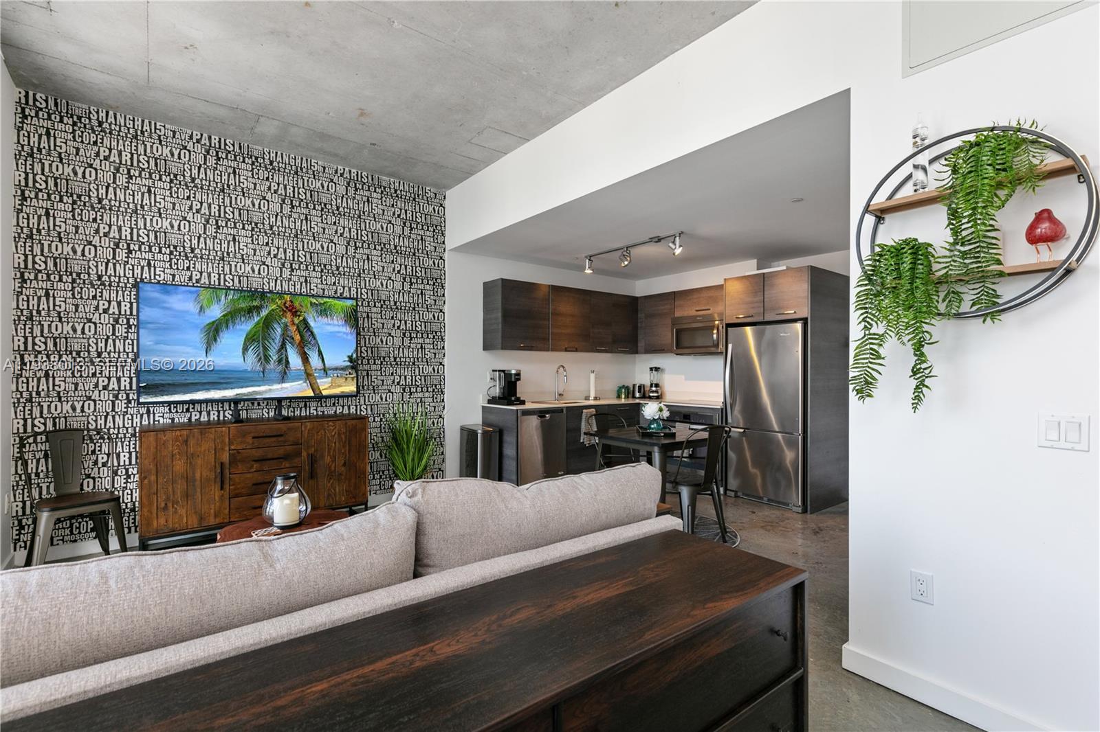 151 Southeast 1st Street, Unit 3103 Miami, FL 33131 - Photo 23 of 51 a living room with furniture and a flat screen tv