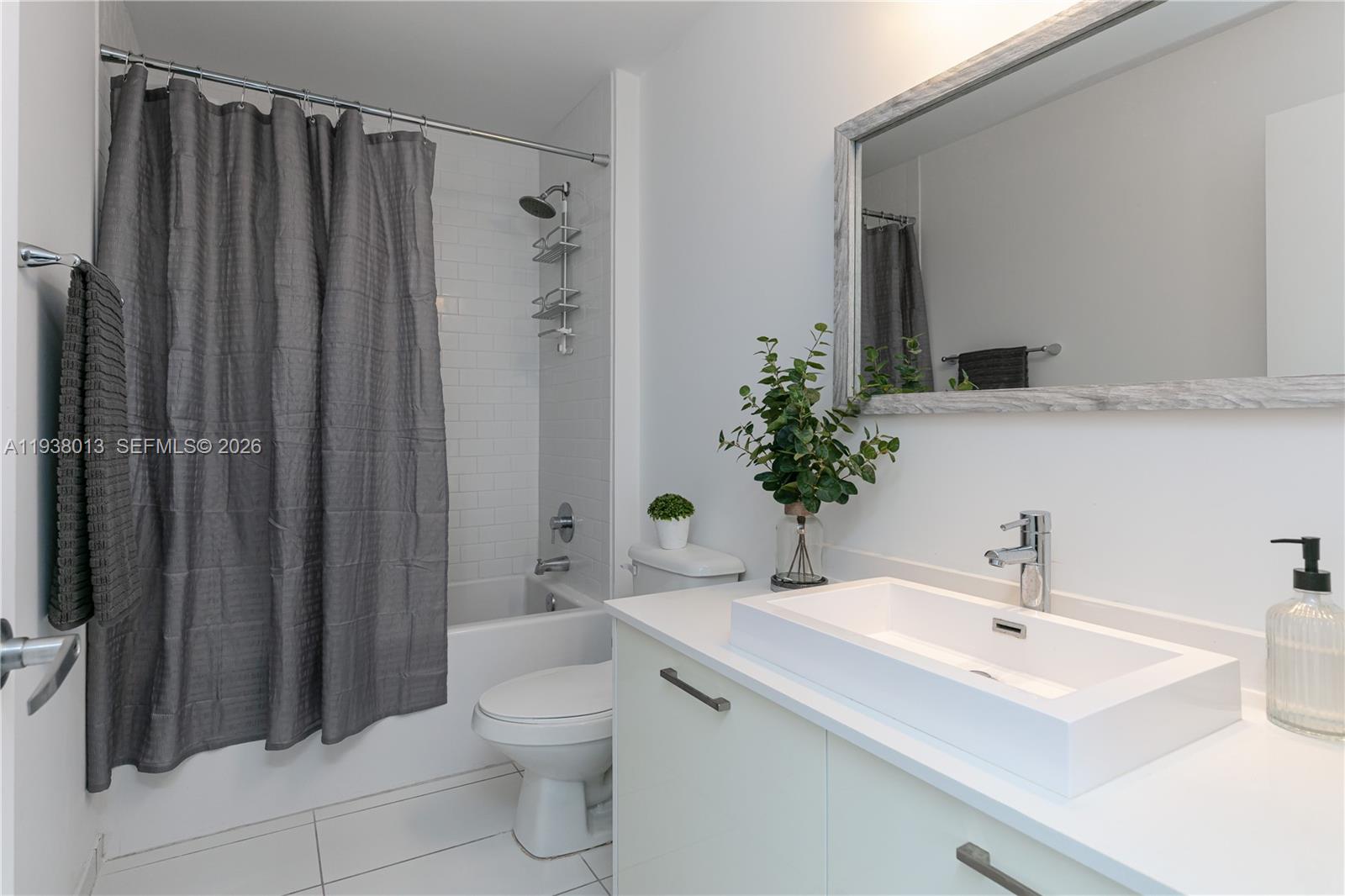 151 Southeast 1st Street, Unit 3103 Miami, FL 33131 - Photo 24 of 51 a bathroom with a sink toilet and shower