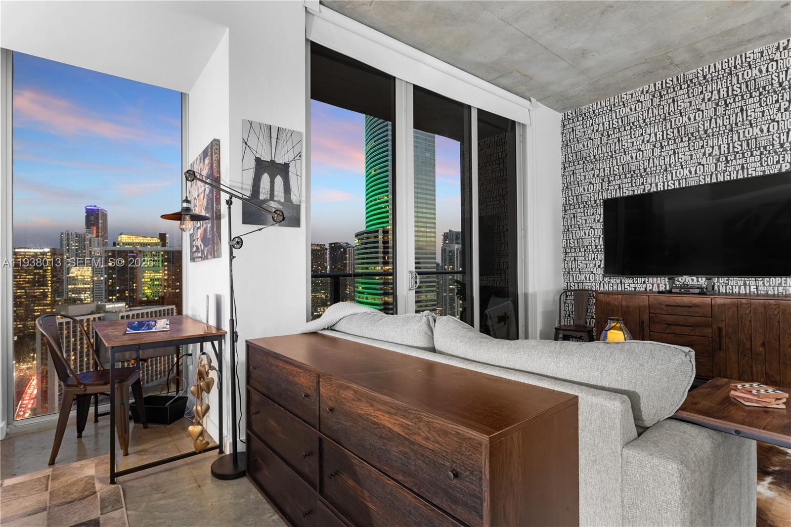 151 Southeast 1st Street, Unit 3103 Miami, FL 33131 - Photo 3 of 51 a room that has a bed and a flat screen tv