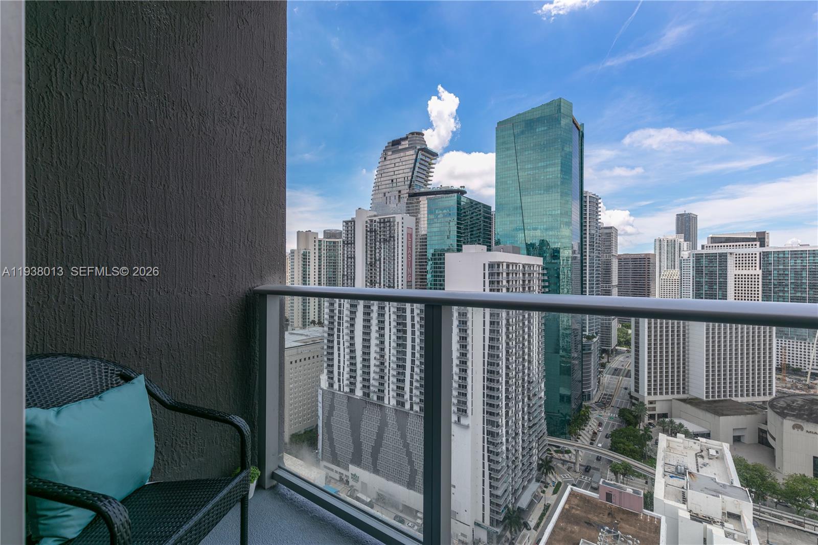 151 Southeast 1st Street, Unit 3103 Miami, FL 33131 - Photo 32 of 51 a view of a balcony with chair