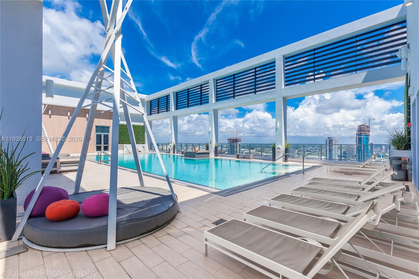 151 Southeast 1st Street, Unit 3103 Miami, FL 33131 - Photo 37 of 51 a view of swimming pool with a patio and glass door